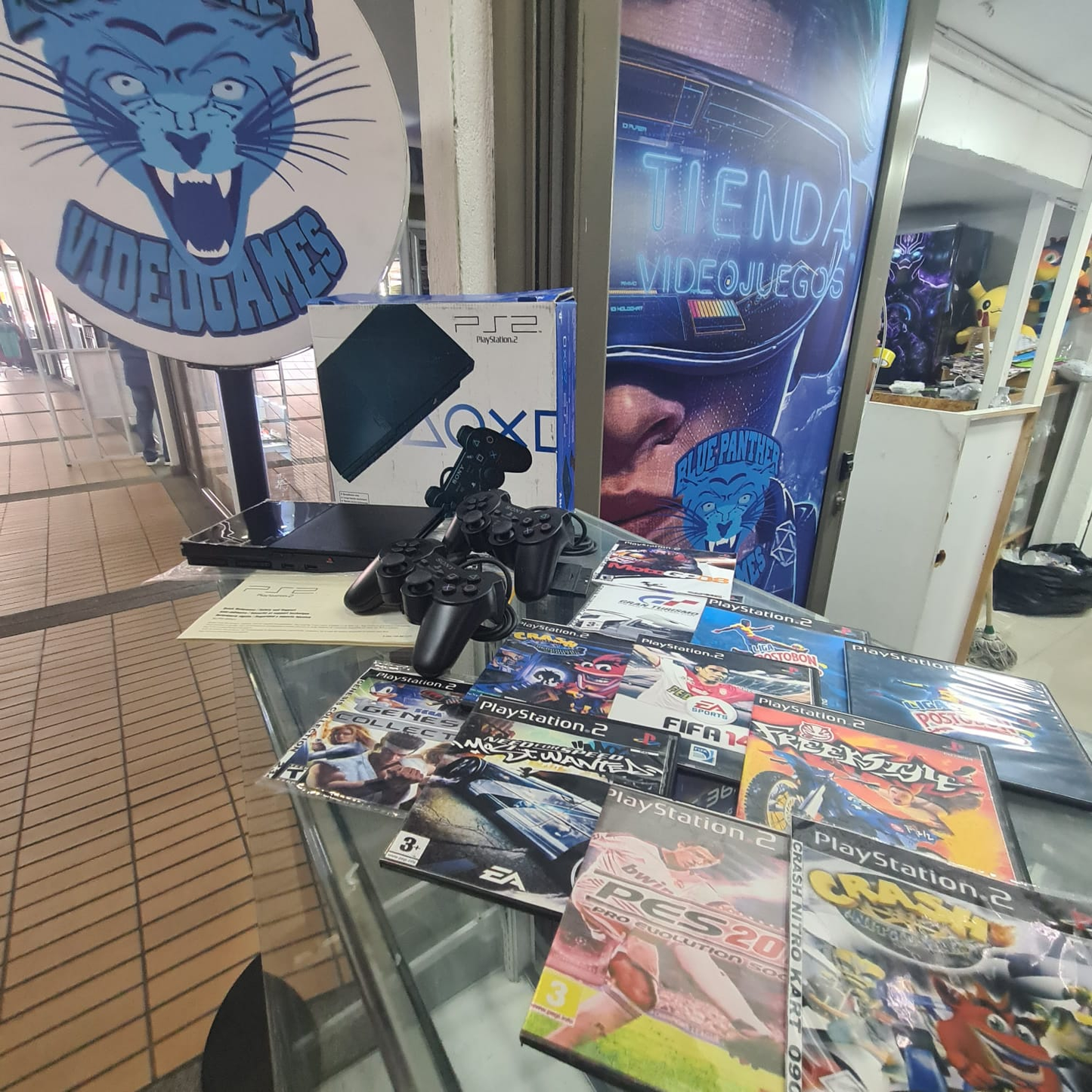 Playstation 2 En caja con manuales +11 juegos+2 controles